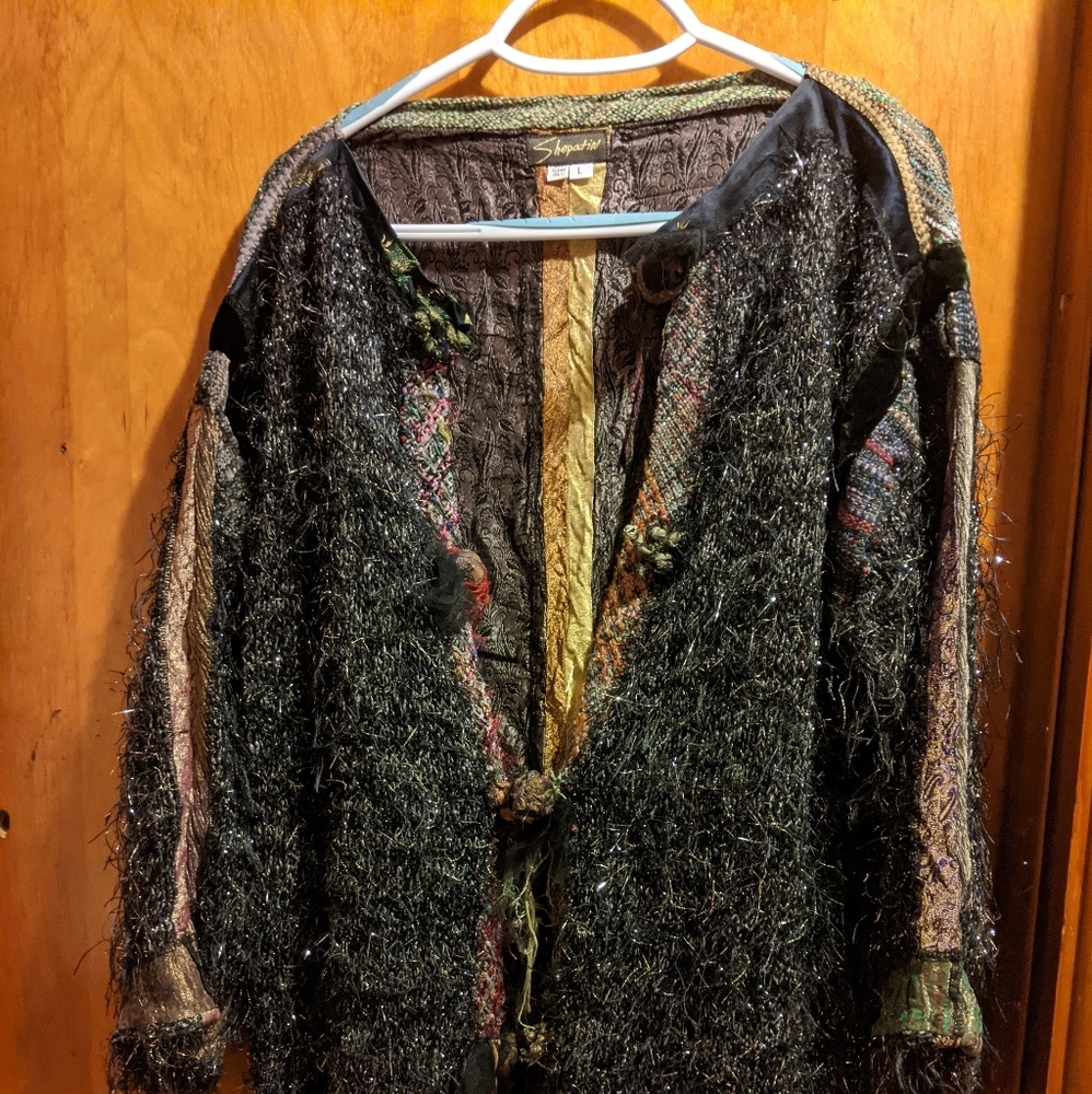 Wild sparkle sweater with lots of fringe.